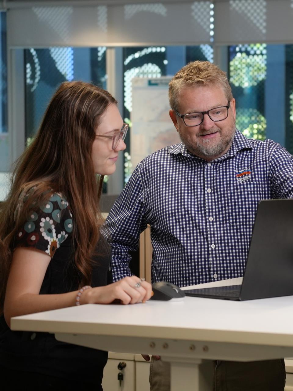 Pilbara Development Commission staff collaborating in an office